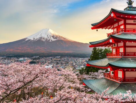 Fujiyoshida, Japan at Chureito Pagoda and Mt. Fuji in the spring with cherry blossoms.